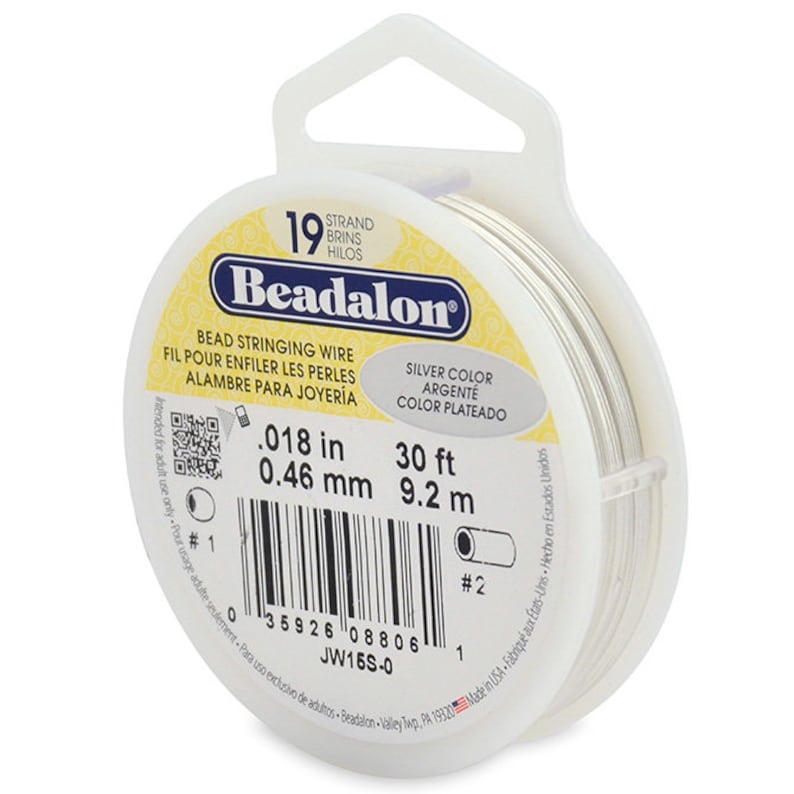 May include: A spool of 19 strand silver colored beadalon bead stringing wire. The spool is 30 feet long and 0.018 inches in diameter. The label reads "Beadalon Bead Stringing Wire" and "Silver Color".