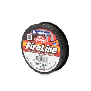 May include: A spool of black Beadalon FireLine microfused braided bead thread. The label is red and black with the text "Beadalon FireLine microfused braided bead thread" and "Smoke". The spool is 50 yards (45 meters).