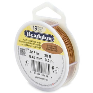 May include: A spool of 30 feet (9.2 meters) of 0.018 inch (0.46 mm) satin copper beading wire. The spool is labeled "Beadalon" and "Satin Copper, Cuivre Satine, Cobre Satinado".