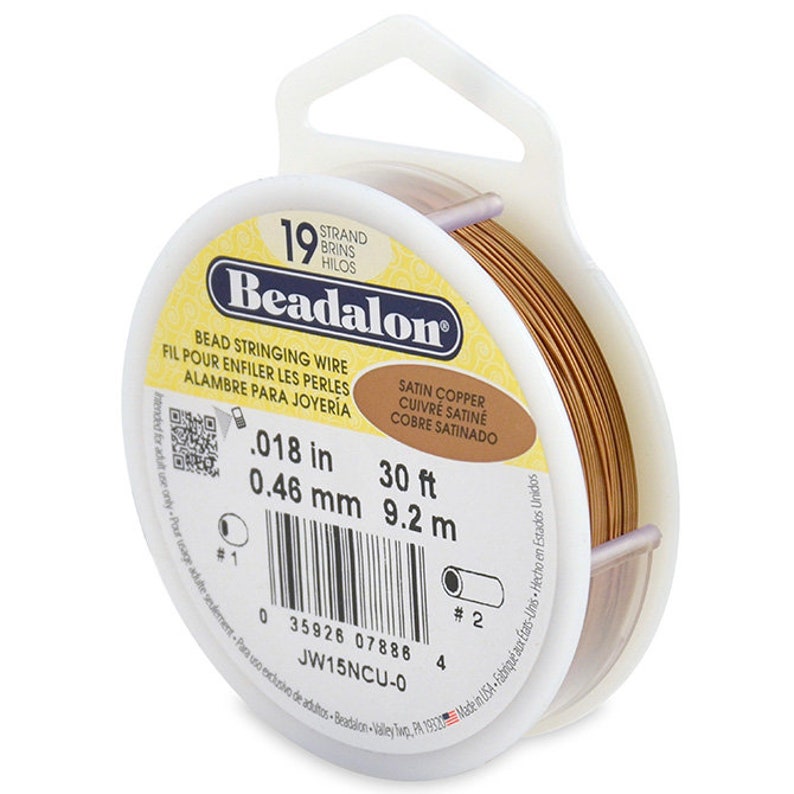 May include: A spool of 30 feet (9.2 meters) of 0.018 inch (0.46 mm) satin copper beading wire. The spool is labeled "Beadalon" and "Satin Copper, Cuivre Satine, Cobre Satinado".