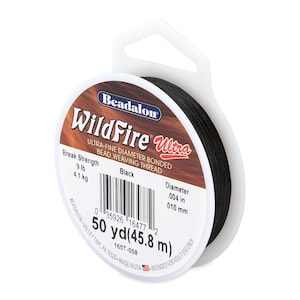 May include: A spool of black WildFire Ultra bead weaving thread. The label indicates a break strength of 9 lb and a diameter of .004 in. The spool contains 50 yd (45.8 m) of thread, suitable for beadwork and jewelry making.