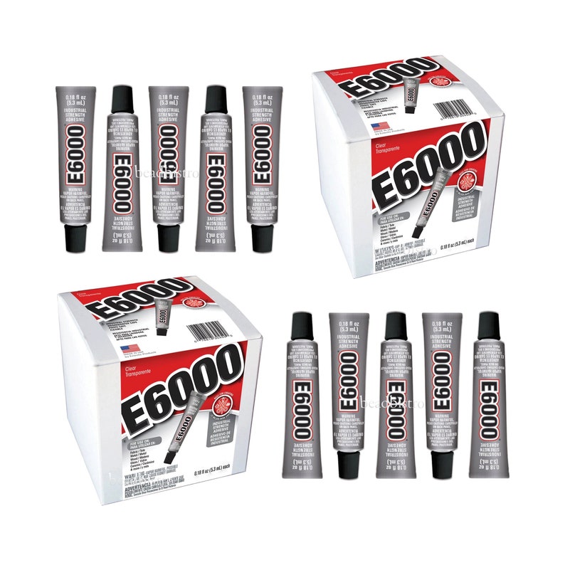 May include: An assortment of E6000 industrial adhesive tubes and boxes. The tubes are grey with black caps, displaying product information. The boxes are white with red and black branding, featuring the product name and a tube illustration.