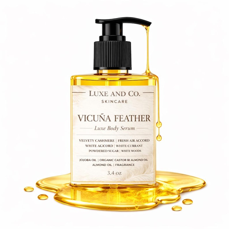May include: A clear square bottle of Luxe and Co. Vicu&ntilde;a Feather body serum with a black pump dispenser. The label lists ingredients including jojoba oil, organic castor oil, and almond oil. The bottle contains 3.4 oz of golden liquid serum.