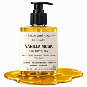 May include: A rectangular glass bottle of Luxe and Co. Vanilla Musk Luxe Body Serum with a black pump dispenser. The label includes the product name and ingredients. The bottle is surrounded by a golden liquid, with measurements of 2oz, 3.4oz, and 7oz.
