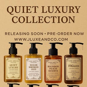 May include: An advertisement for Luxe and Co. skincare products. The image showcases eight body serum bottles with black pumps, each labeled with a unique scent name. The bottles are arranged on a light brown background, with the brand name and collection title prominently displayed.