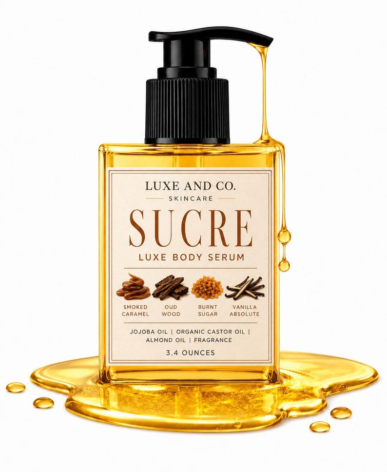 May include: A clear glass bottle of Luxe and Co. Sucre Luxe Body Serum with a black pump dispenser. The label lists ingredients including smoked caramel, oud wood, burnt sugar, and vanilla absolute. The bottle contains 3.4 ounces of golden liquid.