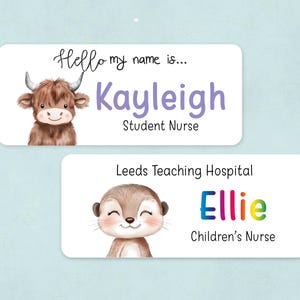 May include: Two name tags featuring cartoon animals. The top tag has a brown Highland cow and says "Hello my name is... Kayleigh Student Nurse". The bottom tag has a brown otter and says "Leeds Teaching Hospital Ellie Children's Nurse".