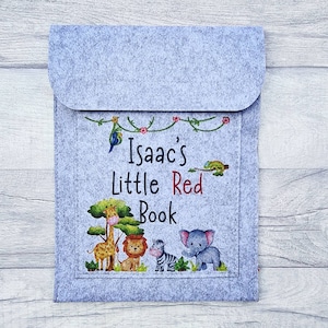 May include: Gray felt book holder with a colorful jungle animal design and the text "Isaac's Little Red Book".
