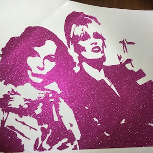 May include: Pink glitter vinyl decal of two people, one with short hair and the other with long hair, both with their heads turned to the side.