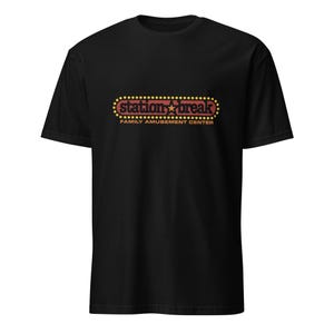 May include: Black t-shirt with the words "Station Break" in a retro-style design. The design is in red and yellow, with a star in the middle. Below the text is "Family Amusement Center".