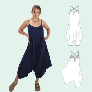 May include: A navy blue jumpsuit with a criss-cross strap back. The jumpsuit has a loose, flowy fit and a wide leg.