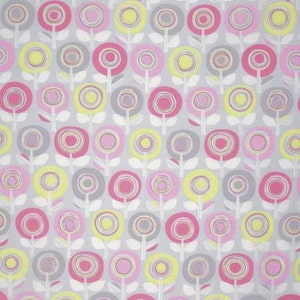 May include: A seamless pattern featuring a repeating design of stylized flowers in shades of pink, yellow, and gray. The flowers have a circular shape with concentric rings of color.