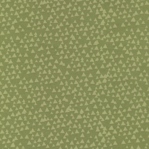 May include: A green fabric with a repeating pattern of small white triangles. The fabric has a subtle texture.