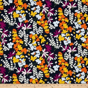 May include: A navy blue fabric with a repeating pattern of stylized flowers in shades of yellow, orange, pink, and white.