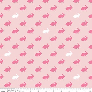 May include: A pink and white seamless pattern featuring repeating silhouettes of bunnies. The background is a light pink color and the bunnies are pink and white.