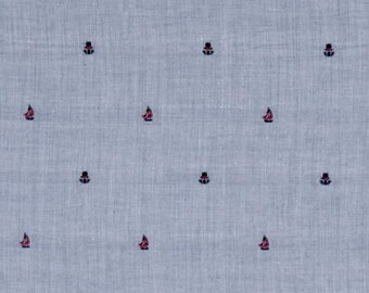 May include: A light blue fabric with a repeating pattern of small red and blue sailboats. The fabric is measured in inches on a ruler.