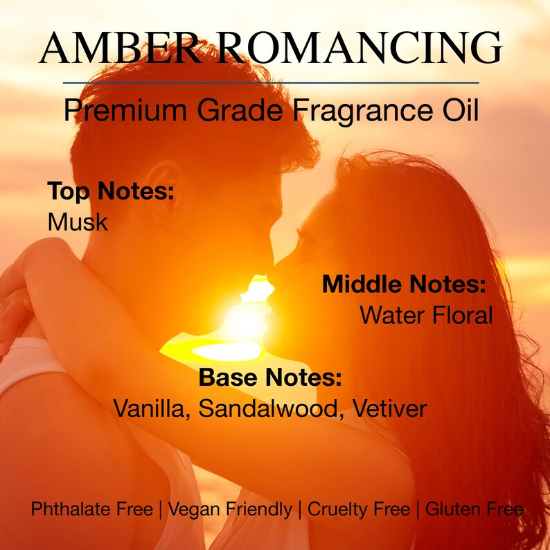 May include: Image of a fragrance oil product with the text "AMBER ROMANCING" and "Premium Grade Fragrance Oil." The image shows a couple in silhouette with the sun setting behind them. The fragrance notes are listed as Musk, Water Floral, Vanilla, Sandalwood, and Vetiver.