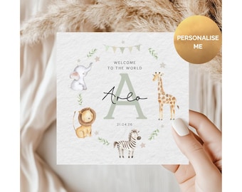 May include: A square baby announcement card with a watercolor illustration of a baby elephant, lion, giraffe, and zebra. The card says "Welcome to the World" and "Arlo" with the date 21.04.26. A gold circle says "Personalise Me".