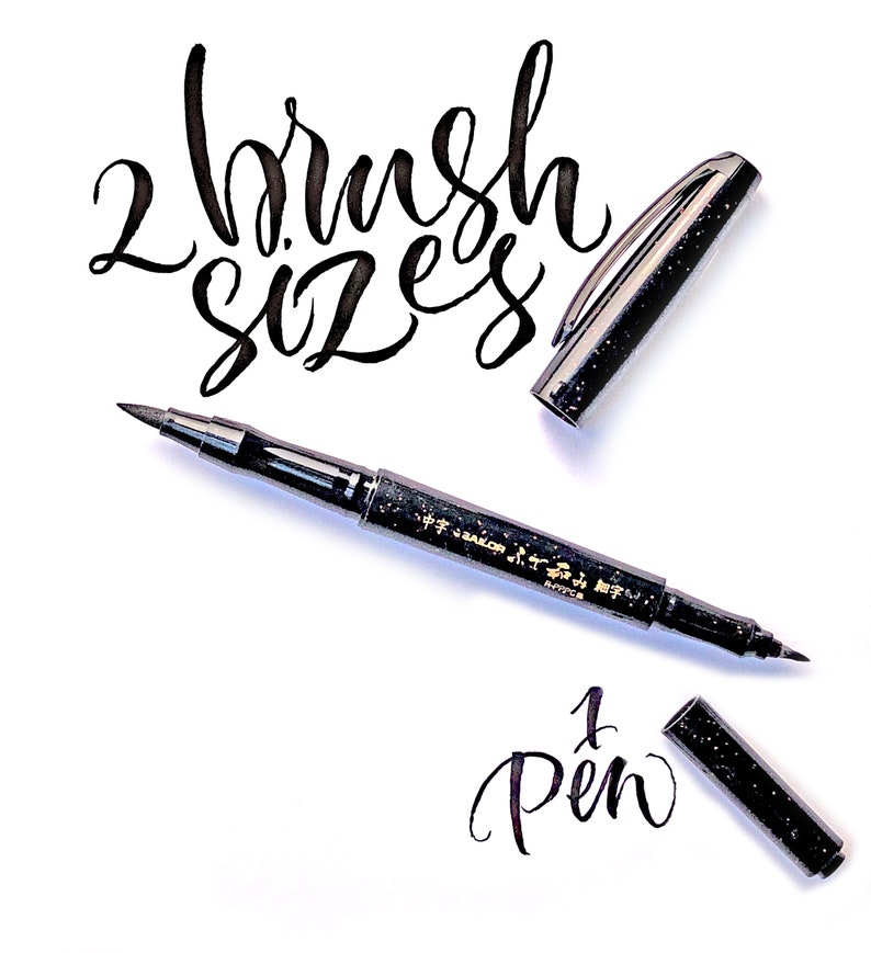 May include: Two black brush pens with gold lettering. The pen on the left has two brush tips, one fine and one broad. The pen on the right has a single brush tip. The text "2 brush sizes" and "1 pen" is written in black ink on a white background.