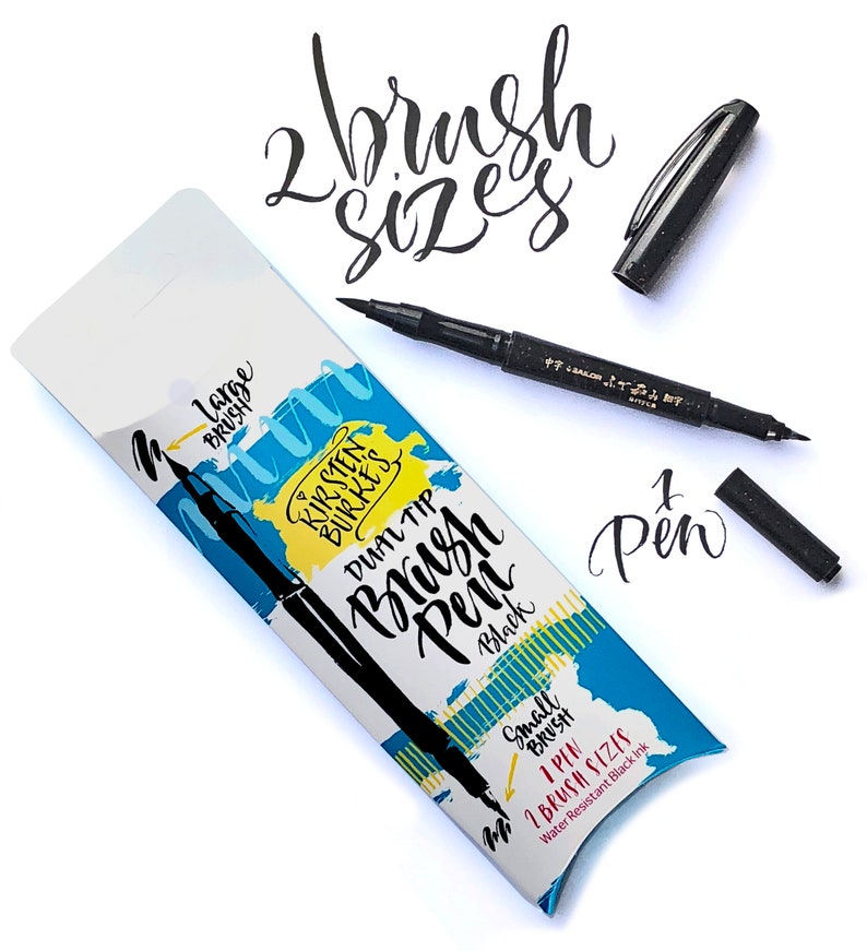 May include: A black dual-tip brush pen with a large and small brush tip. The packaging shows the text "Kirsten Burke's Dual Tip Brush Pen Black" and "1 Pen 1 Brush Sizes Water Resistant Black Ink".