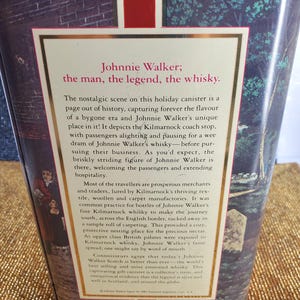 May include: A vintage Johnnie Walker whisky canister with text that reads "Johnnie Walker; the man, the legend, the whisky." The canister features a nostalgic scene with figures and text.