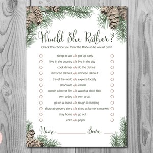 May include: A printable bridal shower game with a woodland theme. The game is called "Would She Rather?" and asks guests to choose between two options for each question. The game is decorated with pine cones and evergreen branches.