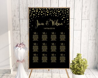 May include: Black wedding seating chart with gold confetti and text. The chart lists table numbers and guest names for a wedding on February 14, 2016.