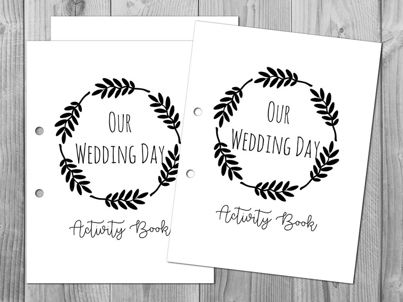 May include: Two printable activity book covers featuring a black wreath design and the text "Our Wedding Day Activity Book".