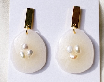 Embedded pearls on translucent clay earrings