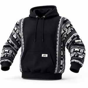May include: Black hoodie with patterned sleeves featuring skulls and crosses. The front of the hoodie has a kangaroo pocket and a drawstring hood. The sleeves have a unique, textured design in shades of gray, black, and white.