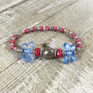 Czech Blue Window Cut Butterfly Bracelet with Cashmere Opal Focal and Red Trumpet Flowers