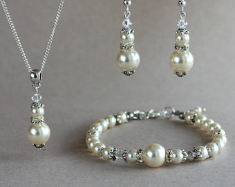 Cristaux de perles de swarovski de crème d'ivoire, bracelet de boucles d'oreilles de collier de pendentif argenté, ensemble d'accessoire savant de mariée de mariage de mariage de cru
