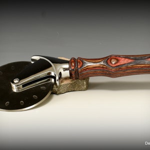 Stainless steel pizza cutter with removable wood handle