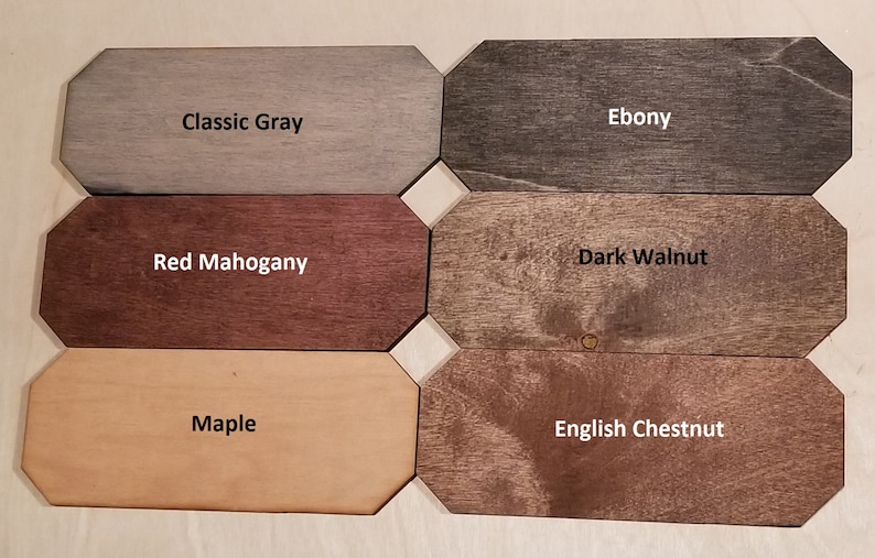 May include: Six wood samples stained in different colors: Classic Gray, Ebony, Red Mahogany, Dark Walnut, Maple, and English Chestnut.