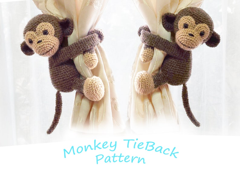 May include: Two brown crocheted monkey tiebacks holding onto beige curtains. The text "Monkey TieBack Pattern" is written below the monkeys.