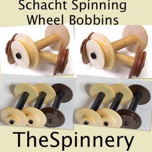 May include: Four wooden spinning wheel bobbins. Two are natural wood with brown accents and two are black with brown accents. The bobbins are arranged in two pairs, with the natural wood bobbins on top and the black bobbins on the bottom. The image is labeled "Schacht Spinning Wheel Bobbins" and "The Spinnery".