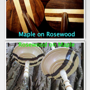 May include: Two wooden spinning wheels with different wood combinations. The top image shows a spinning wheel with a rosewood base and maple top with two maple stripes. The bottom image shows a spinning wheel with a maple base and rosewood top with two black stripes.