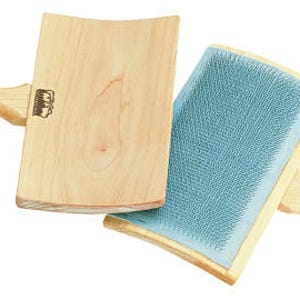 May include: Two wooden wool carders with a blue carding cloth on one side and a smooth wooden surface on the other. The carders have wooden handles.