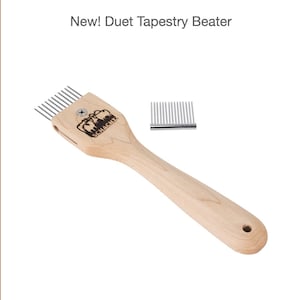 May include: A wooden tapestry beater with a metal comb on the end. The beater is labeled "Schacht".