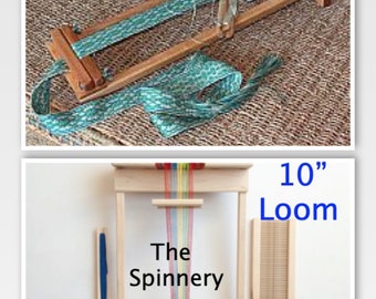 May include: Two wooden looms for weaving, one is 4 inches wide and the other is 10 inches wide. The smaller loom has a teal and green woven band on it. The larger loom has a rainbow colored warp thread on it. The larger loom is labeled "The Spinnery".