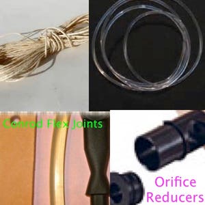 May include: A set of crafting supplies for making jewelry or other crafts. The set includes a spool of white string, a set of clear rubber bands, and a set of black plastic connectors labeled "Conrad Flex Joints" and "Orifice Reducers".