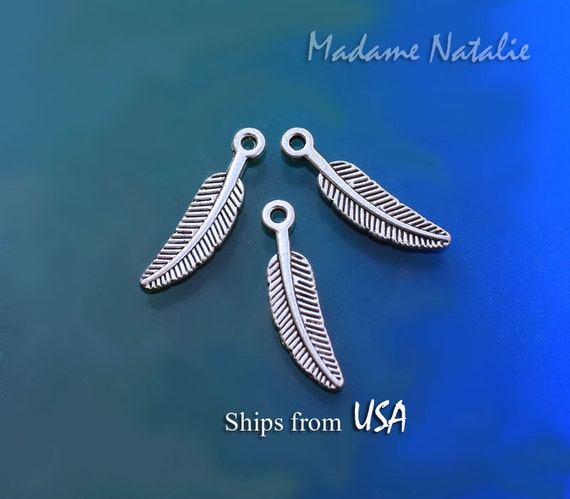 4 Tibetan Silver Feather charms With Bail Beads