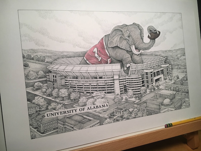 May include: A black and white illustration of an elephant wearing a red and white jersey with the number "1" on it. The elephant is sitting on top of a football stadium with the text "UNIVERSITY OF ALABAMA!" printed below.