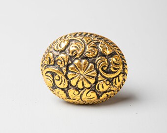 Perilla ovalada de hierro fundido: tirador de cajón con diseño floral dorado metálico