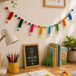 May include: A felt garland featuring colorful pencil-shaped ornaments and small spheres in red, green, pink, yellow, blue, and orange, strung on a white cord. The pencil shapes have pointed tips and are interspersed with round felt balls along the length.