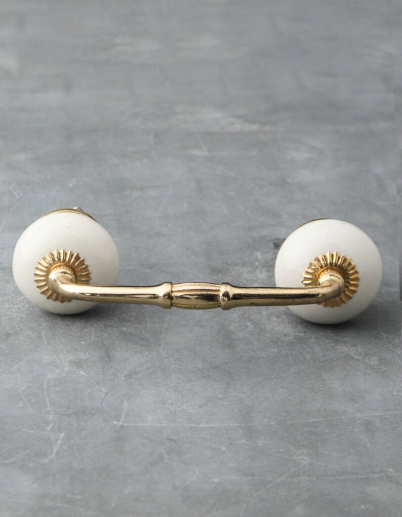 Cream Colored Unique Ceramic Handle Pull sold in Etsy