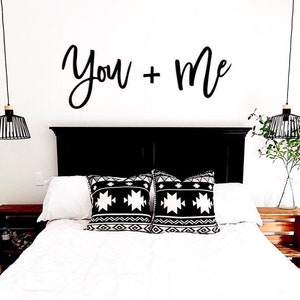 You + Me above bed sign