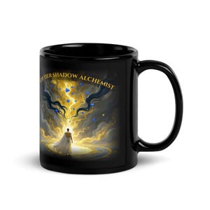 May include: Black ceramic mug with an illustration of a figure in a white gown, surrounded by golden light and blue accents. The mug has the text "TOP TIER SHADOW ALCHEMIST" in gold lettering.