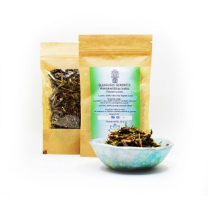 May include: A brown paper pouch with a label that reads "BLIZGUSIS SERENTIS Meksikietiškas kietis (Tagetes Lucida)". The pouch contains dried herbs and is labelled with the text "Grynas svoris: 25 g".
