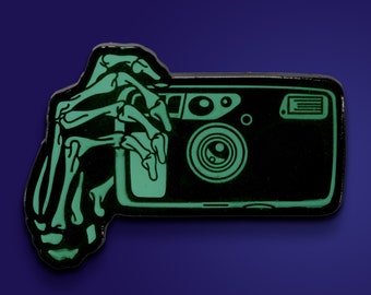35mm Point and Shoot Film Camera Skeleton Hands Glow in the Dark Lapel Pin